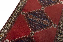 Backside of handmade 2000s Shiraz rug showing knot structure and weave density