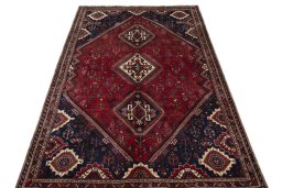 Surface texture of 2000s Shiraz rug with natural Wool and intricate pattern
