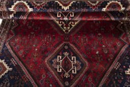 Full view of 2000s Shiraz rug from Iran / Persia, 290 × 184 cm in Red tones