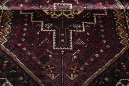 Corner detail of 2000s Shiraz rug showing border pattern and Wool pile