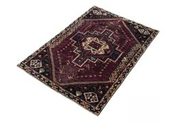 Corner detail of 2000s Shiraz rug showing border pattern and Wool pile