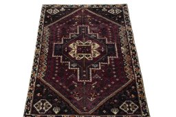 Surface texture of 2000s Shiraz rug with natural Wool and intricate pattern