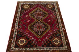 Surface texture of 2000s Shiraz rug with natural Wool and intricate pattern