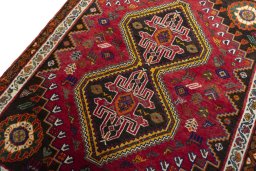 Backside of handmade 2000s Shiraz rug showing knot structure and weave density