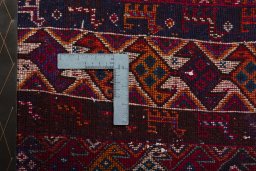 Backside of handmade 2000s Shiraz rug showing knot structure and weave density