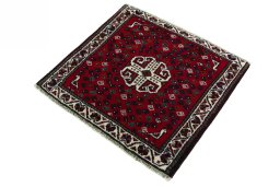 Corner detail of 2000s Shiraz rug showing border pattern and Wool pile