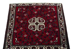 Surface texture of 2000s Shiraz rug with natural Wool and intricate pattern