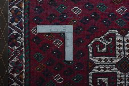 Backside of handmade 2000s Shiraz rug showing knot structure and weave density