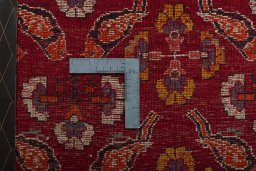 Backside of handmade 2000s Shiraz rug showing knot structure and weave density