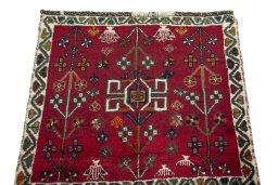 Surface texture of 2000s Shiraz rug with natural Wool and intricate pattern