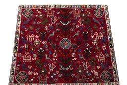 Surface texture of 2000s Shiraz rug with natural Wool and intricate pattern