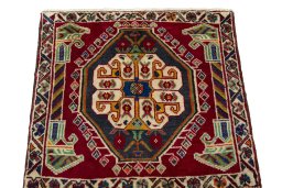 Surface texture of 2000s Shiraz rug with natural Wool and intricate pattern