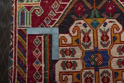 Backside of handmade 2000s Shiraz rug showing knot structure and weave density