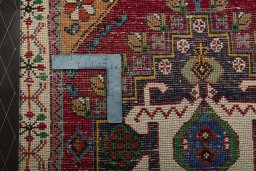 Backside of handmade 2000s Shiraz rug showing knot structure and weave density