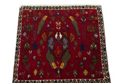 Surface texture of 2000s Shiraz rug with natural Wool and intricate pattern