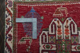 Backside of handmade 2000s Shiraz rug showing knot structure and weave density
