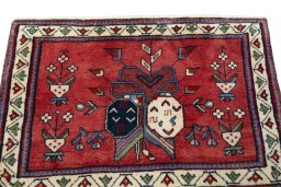 Surface texture of 2000s Shiraz rug with natural Wool and intricate pattern
