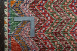 Backside of handmade 2000s Shiraz rug showing knot structure and weave density