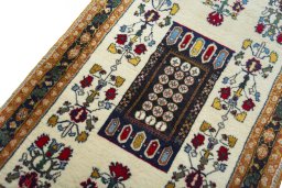 Backside of handmade 2000s Shiraz rug showing knot structure and weave density