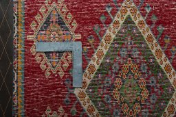 Backside of handmade 2000s Shiraz rug showing knot structure and weave density