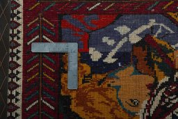 Backside of handmade 2000s Shiraz rug showing knot structure and weave density