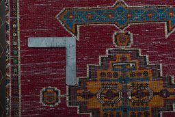 Backside of handmade 2000s Shiraz rug showing knot structure and weave density