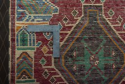 Backside of handmade 2000s Shiraz rug showing knot structure and weave density