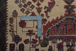 Backside of handmade 2000s Shiraz rug showing knot structure and weave density