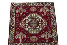 Surface texture of 2000s Shiraz rug with natural Wool and intricate pattern