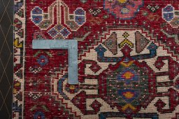 Backside of handmade 2000s Shiraz rug showing knot structure and weave density