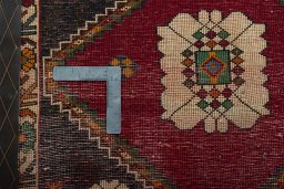 Backside of handmade 2000s Shiraz rug showing knot structure and weave density