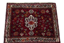 Surface texture of 2000s Shiraz rug with natural Wool and intricate pattern