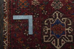 Backside of handmade 2000s Shiraz rug showing knot structure and weave density