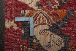 Backside of handmade 2000s Shiraz rug showing knot structure and weave density