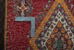 Backside of handmade 2000s Shiraz rug showing knot structure and weave density