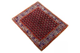 Corner detail of 2000s Shiraz rug showing border pattern and Wool pile