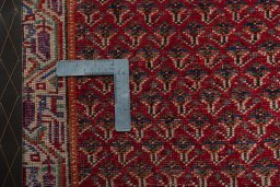Backside of handmade 2000s Shiraz rug showing knot structure and weave density