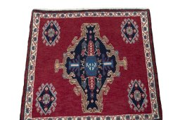 Surface texture of 2000s Shiraz rug with natural Wool and intricate pattern