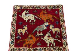 Surface texture of 2000s Shiraz rug with natural Wool and intricate pattern