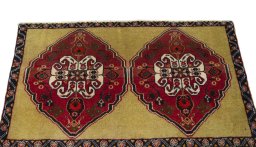 Surface texture of 2000s Shiraz rug with natural Wool and intricate pattern