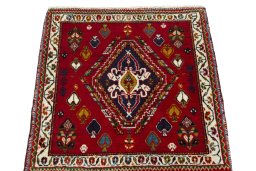 Surface texture of 2000s Shiraz rug with natural Wool and intricate pattern