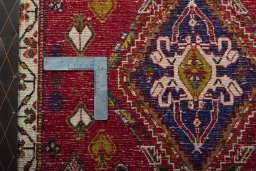 Backside of handmade 2000s Shiraz rug showing knot structure and weave density