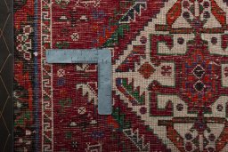 Backside of handmade 2000s Shiraz rug showing knot structure and weave density