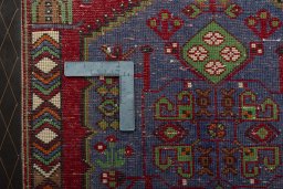 Backside of handmade 2000s Shiraz rug showing knot structure and weave density