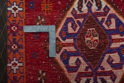 Backside of handmade 2000s Shiraz rug showing knot structure and weave density
