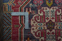Backside of handmade 2000s Shiraz rug showing knot structure and weave density