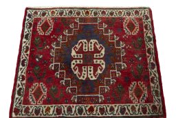 Surface texture of 2000s Shiraz rug with natural Wool and intricate pattern