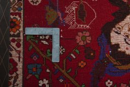 Backside of handmade 2000s Shiraz rug showing knot structure and weave density