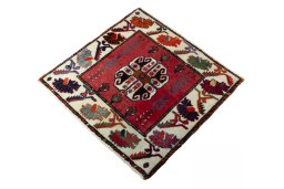 Corner detail of 2000s Shiraz rug showing border pattern and Wool pile