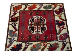 Surface texture of 2000s Shiraz rug with natural Wool and intricate pattern